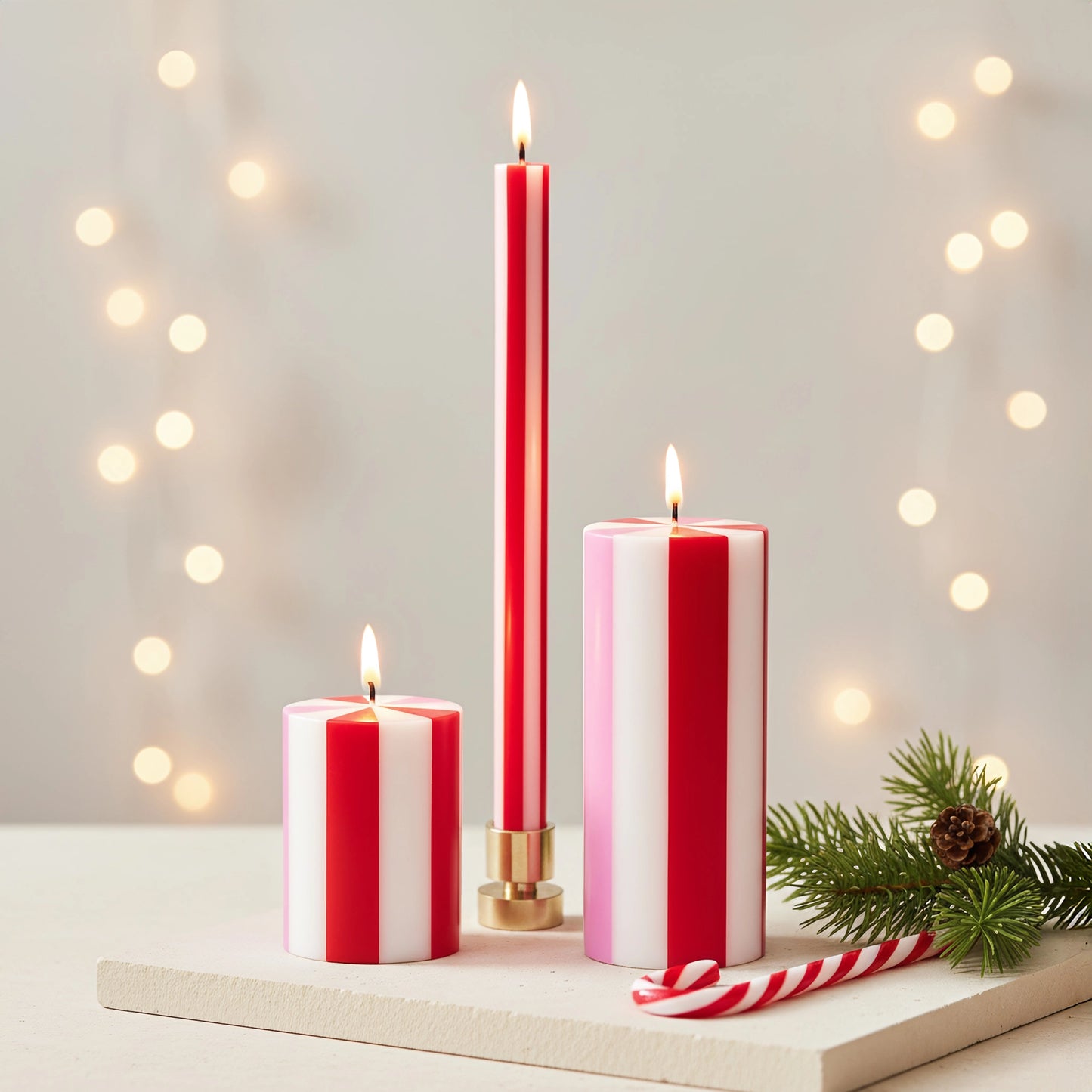 Set of red and white striped candles hand poured in Java, Indonesia using artisanal production techniques. The workshop provides training and fair wages to hundreds of rural women enabling them to support their families.
The wax is 100% plant-based and is RSPO certified to ensure responsible environmental stewardship. They are like a cross section of a candy cane and would look perfect in a pink and red themed holiday decor. They also would be a great addition to a candy themed Christmas. Find it at Huset 