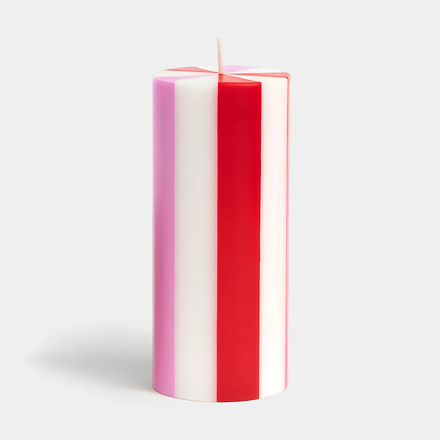 Set of red and white striped candles hand poured in Java, Indonesia using artisanal production techniques. The workshop provides training and fair wages to hundreds of rural women enabling them to support their families.
The wax is 100% plant-based and is RSPO certified to ensure responsible environmental stewardship. They are like a cross section of a candy cane and would look perfect in a pink and red themed holiday decor. They also would be a great addition to a candy themed Christmas. Find it at Huset 