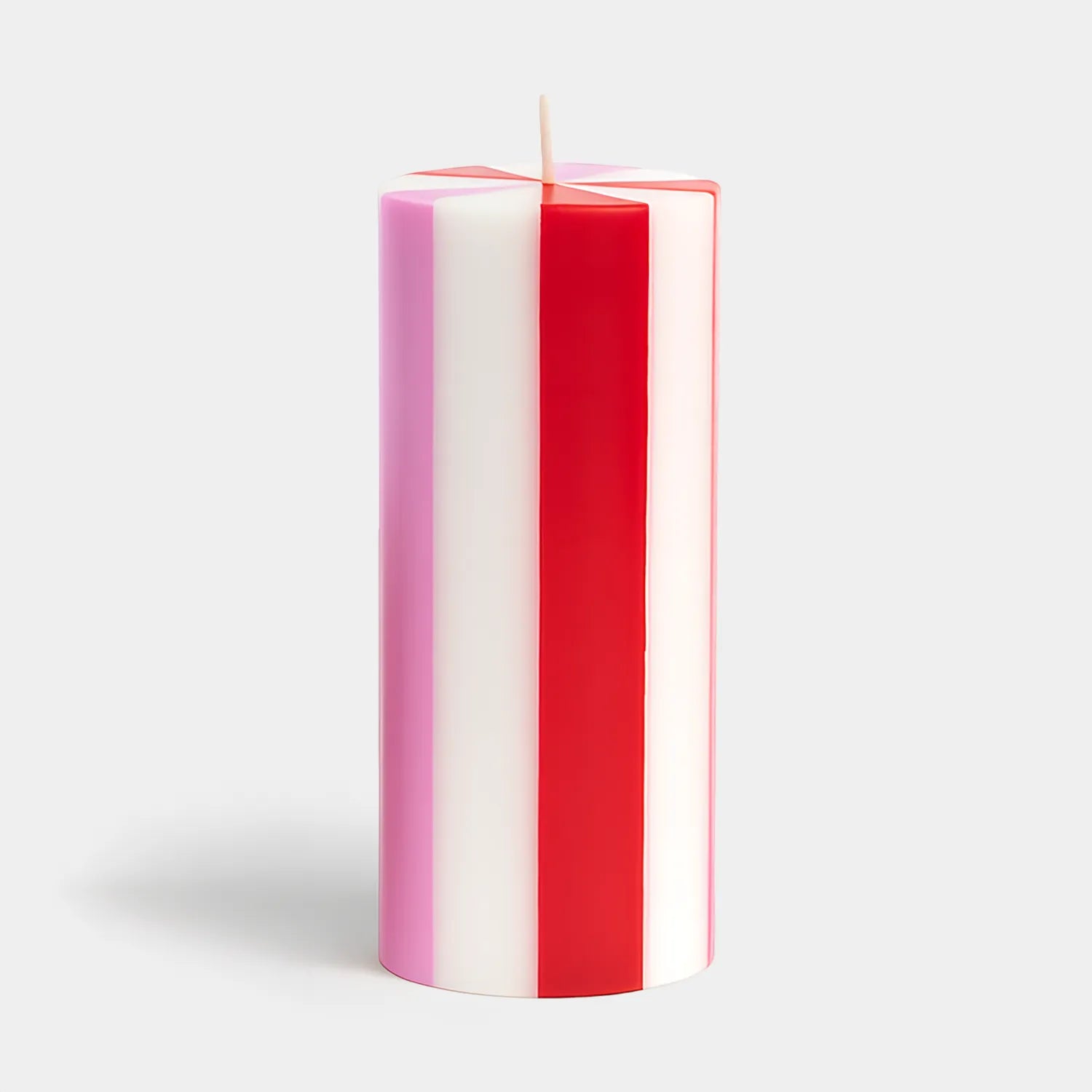 Set of red and white striped candles hand poured in Java, Indonesia using artisanal production techniques. The workshop provides training and fair wages to hundreds of rural women enabling them to support their families.
The wax is 100% plant-based and is RSPO certified to ensure responsible environmental stewardship. They are like a cross section of a candy cane and would look perfect in a pink and red themed holiday decor. They also would be a great addition to a candy themed Christmas. Find it at Huset 