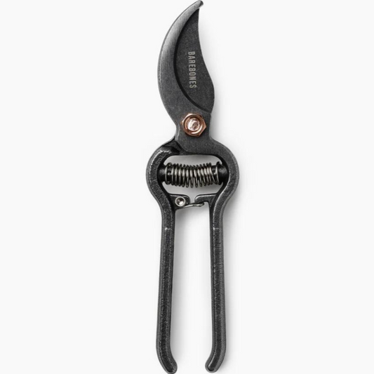 A pair of garden pruners with black handles and steel construction, featuring copper accents.