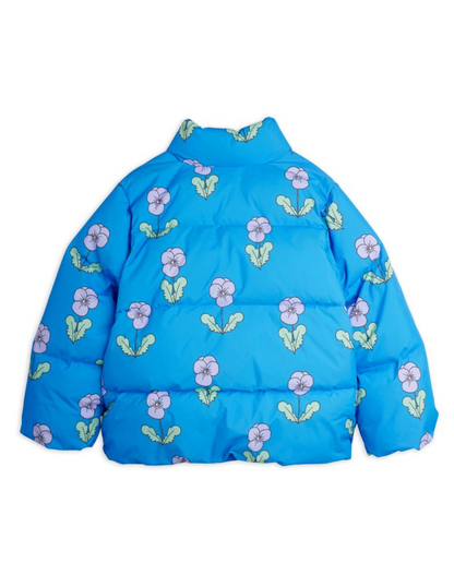 A blue puffer jacket with an all-over floral print of light purple flowers and green leaves, shown against a plain white background.