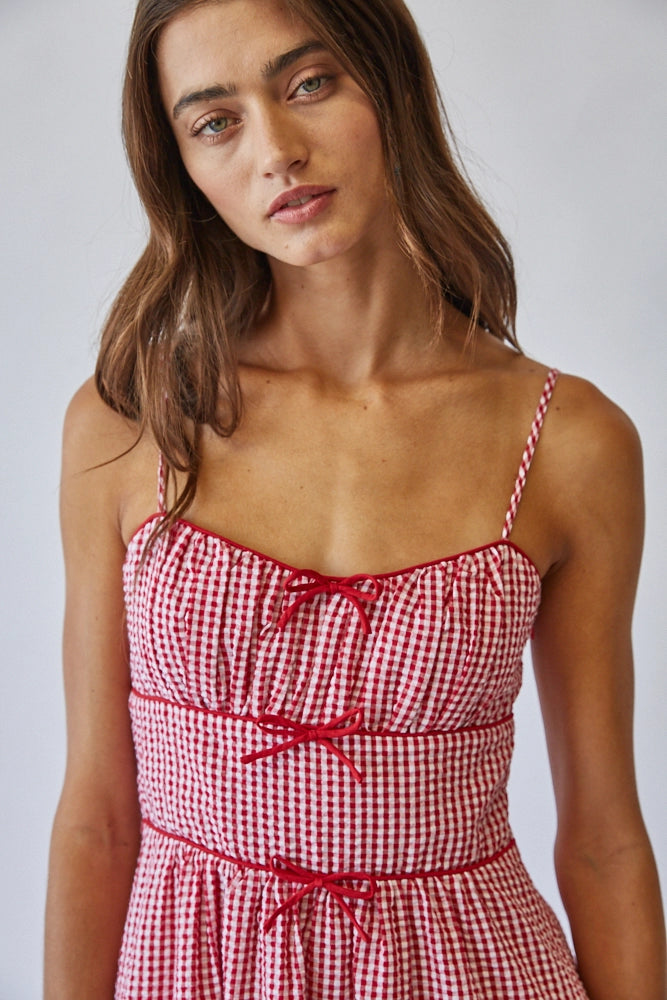 Woman wearing Red Bow Dress On white background