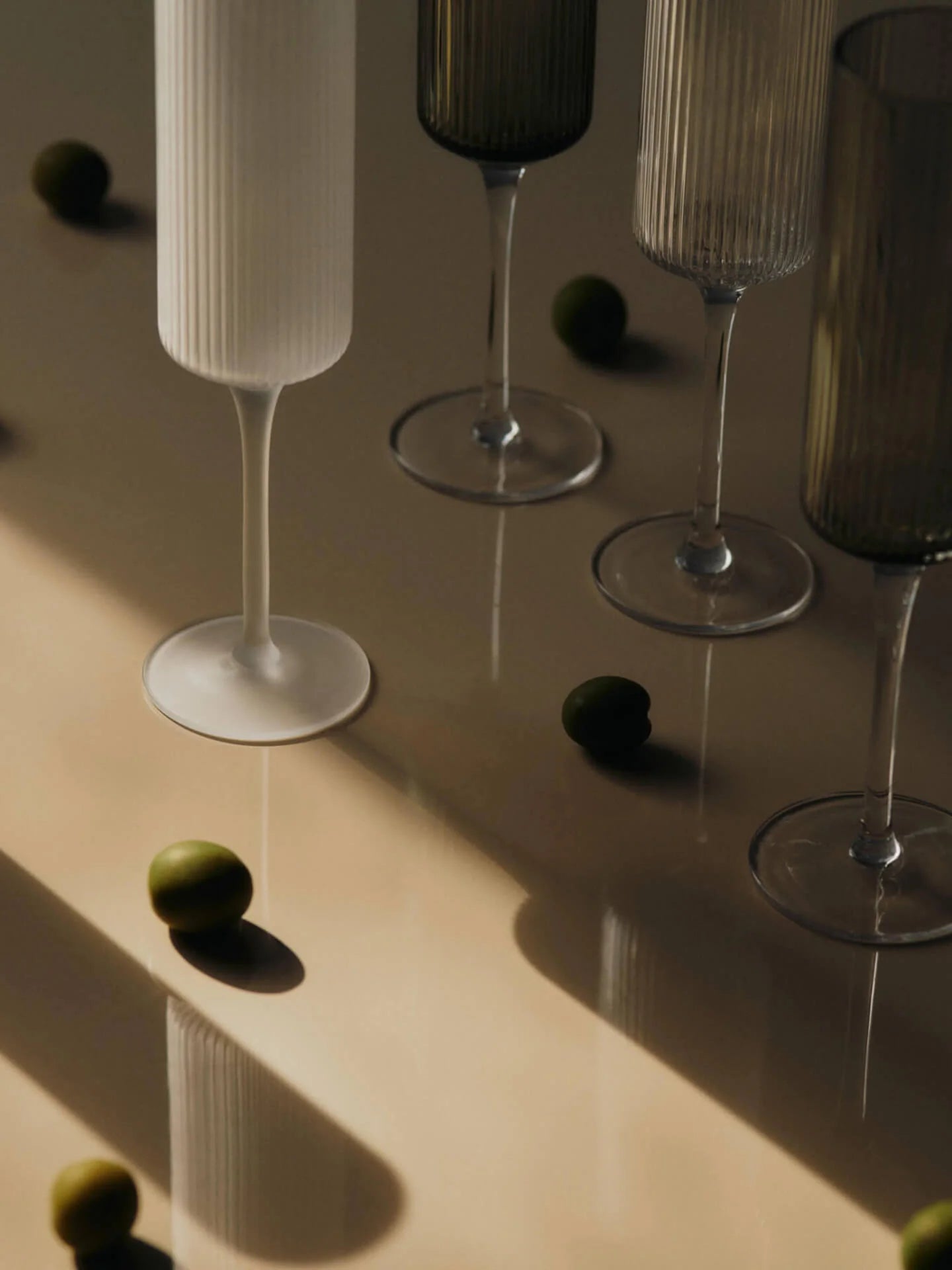 The Ripple Champagne Flutes bring a refined, elongated silhouette to the beloved Ripple series, perfectly suited for sparkling wines. Mouth-blown into the mould, each glass features the signature rippled surface that adds texture and a sense of movement. Their tall, slender shape enhances bubbles and aroma, making any toast feel celebratory.
