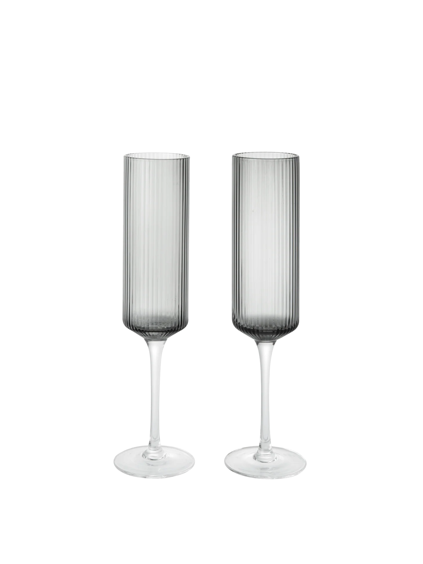 The Ripple Champagne Flutes bring a refined, elongated silhouette to the beloved Ripple series, perfectly suited for sparkling wines. Mouth-blown into the mould, each glass features the signature rippled surface that adds texture and a sense of movement. Their tall, slender shape enhances bubbles and aroma, making any toast feel celebratory.