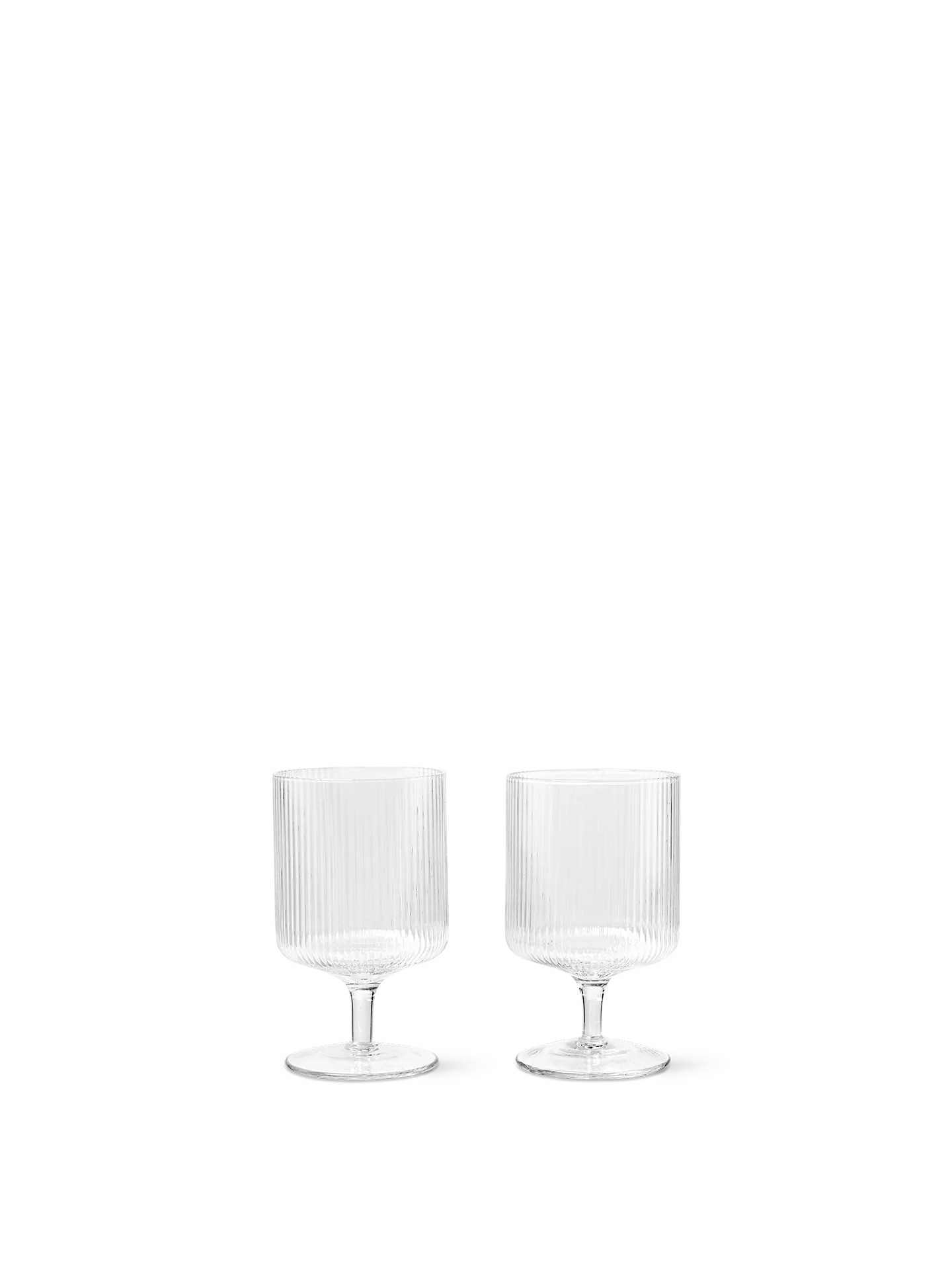 For a casual drink in the garden, the large dinner party or as the fancy supplement at brunch, the Ripple Wine Glass will complete any setting with its unique expression. Mouth-blown into the shape the wine glasses feature the series' characteristic rippled surface and geometric silhouette, making the set of two glasses stack able. Pair the glasses with the rest of the Ripple series and serve your favorite beverage in style.