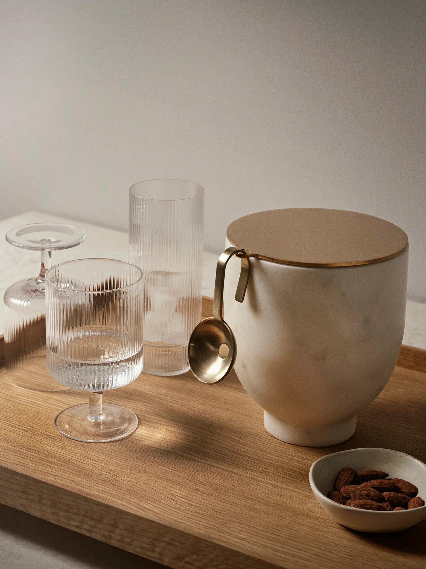 For a casual drink in the garden, the large dinner party or as the fancy supplement at brunch, the Ripple Wine Glass will complete any setting with its unique expression. Mouth-blown into the shape the wine glasses feature the series' characteristic rippled surface and geometric silhouette, making the set of two glasses stack able. Pair the glasses with the rest of the Ripple series and serve your favorite beverage in style.
