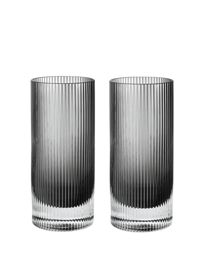Two tall, clear ribbed glass tumblers with a dark gradient at the bottom, shown side by side on a plain white background.