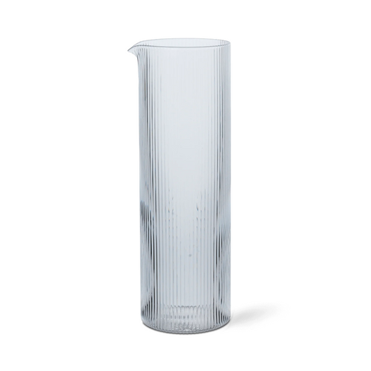 Clear glass vase with ribbed texture on a white background