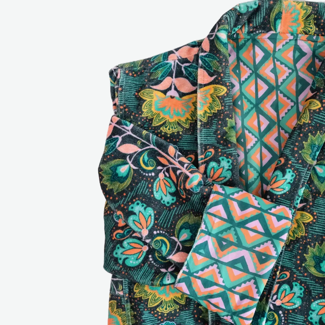 This duster coat is pure luxury, crafted of silky plush cotton velvet and smooth woven cotton on the reverse. We call this a duster because it can be worn as a robe or a coat--it even has pockets on both sides! This coat features a signature Handker hand-drawn pattern and is a cuddly hug no matter how you wear it.