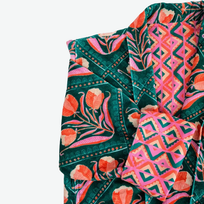 This duster coat is pure luxury, crafted of silky plush cotton velvet and smooth woven cotton on the reverse. We call this a duster because it can be worn as a robe or a coat--it even has pockets on both sides! This coat features a signature Handker hand-drawn pattern and is a cuddly hug no matter how you wear it.