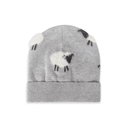 A light gray knit beanie hat featuring a pattern of white sheep with black faces and legs, finished with a ribbed cuff, shown against a plain white background.