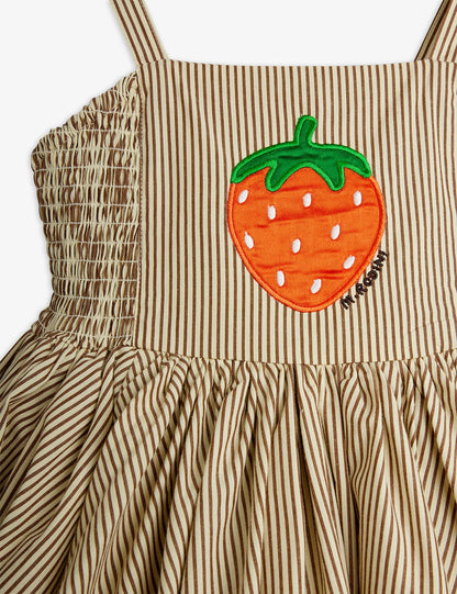 Striped dress with a strawberry applique on a white background