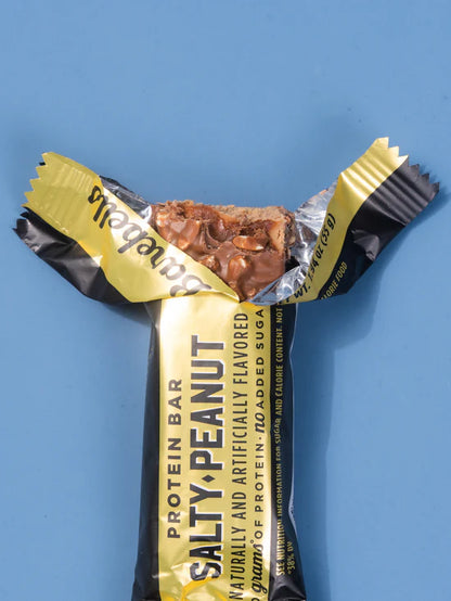 Protein bar with 'Salty Peanut' flavor on a blue background