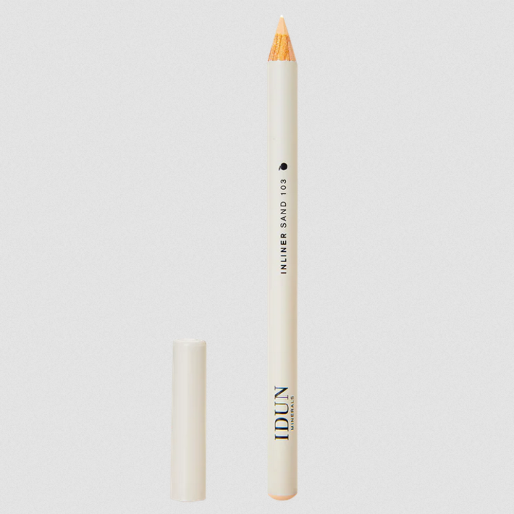 IDUN Minerals Cream Inliner in shade Sand, a creamy beige eyeliner, with the cap removed, displayed on a white background.