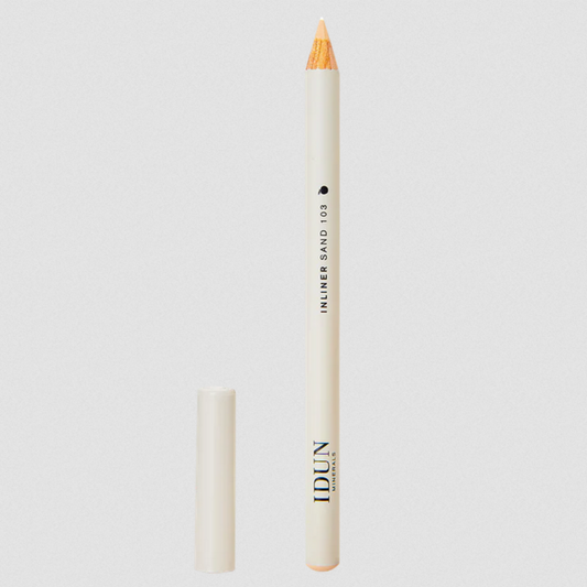 IDUN Minerals Cream Inliner in shade Sand, a creamy beige eyeliner, with the cap removed, displayed on a white background.