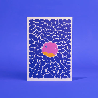 Card with blue abstract pattern and pink and orange center on a blue background it is a dish in coral and supports the ocean and animals in the Amazon.