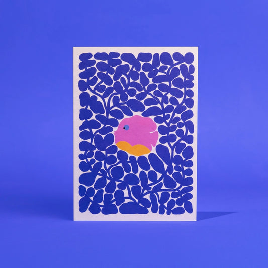 Card with blue abstract pattern and pink and orange center on a blue background it is a dish in coral and supports the ocean and animals in the Amazon.