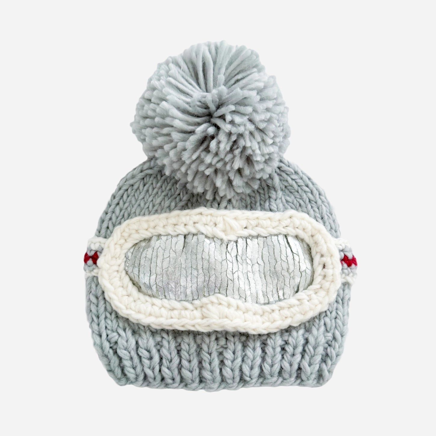 Gray knit beanie with pom-pom and goggles on a white background