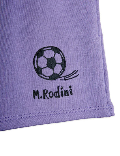 Purple fabric with a soccer ball design and 'M.Rodini' text on a white background