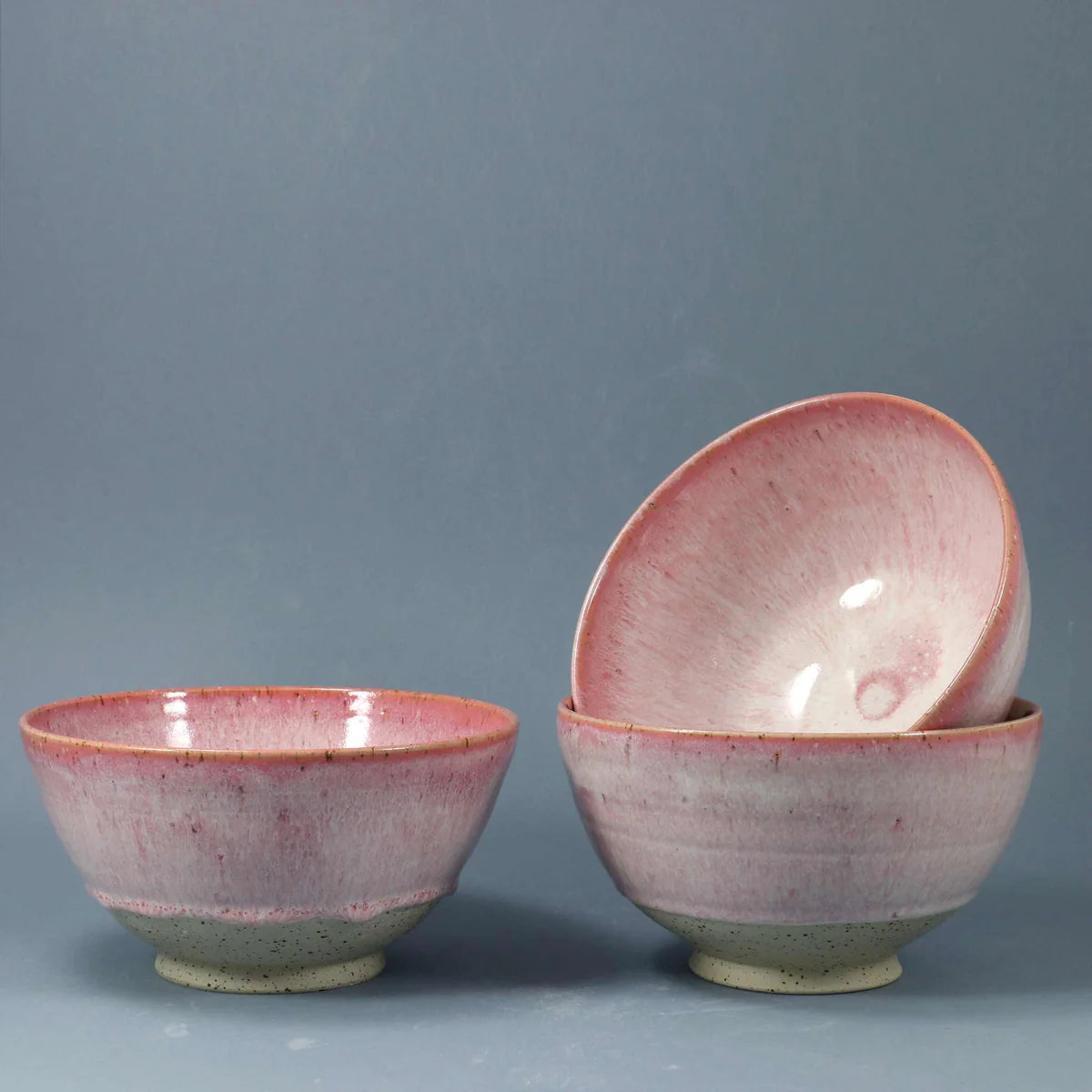 Pink Ceramic Bowls on blue background