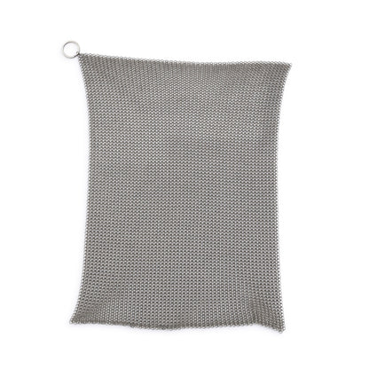 Metal chainmail scrubber on a white background