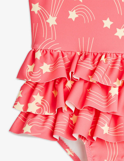 Pink Ruffled swimsuit with white star and line patterns on a white background