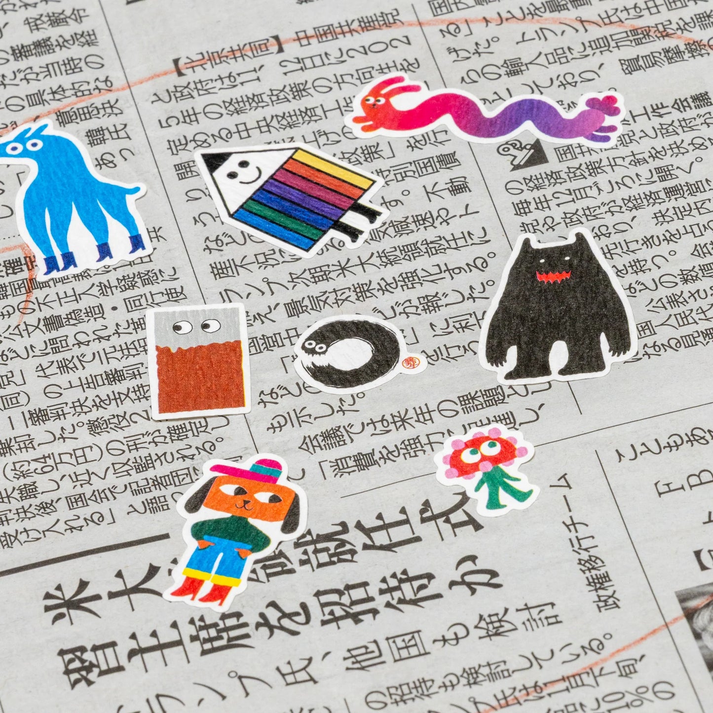 Colorful stickers on a piece of paper with text
