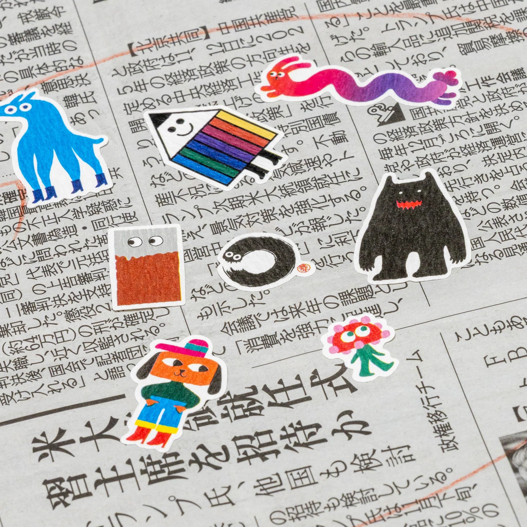 Colorful stickers on a piece of paper with text
