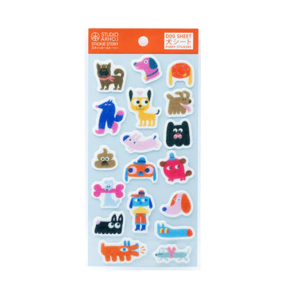 Studio Artoisan 'Dog Sheet' sticker pack featuring various colorful cartoon dog illustrations on a light blue backing sheet with an orange header card.