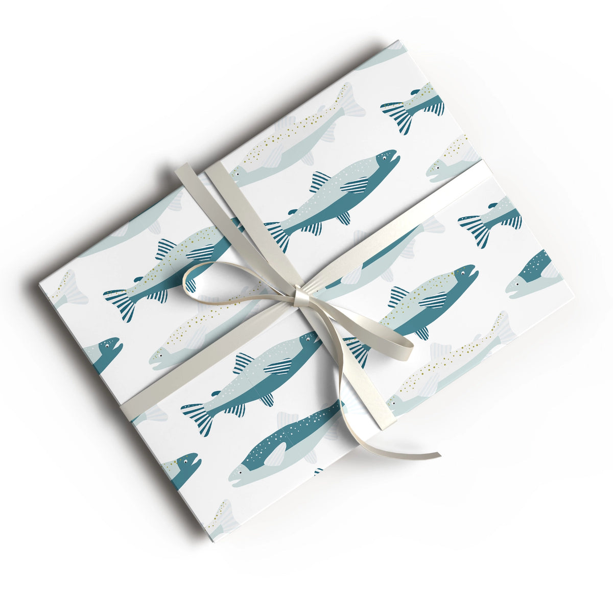 Three rectangular gift boxes wrapped in white paper printed with a repeating pattern of stylized fish in teal and pale blue, tied together with a white ribbon and bow on a light gray background.
