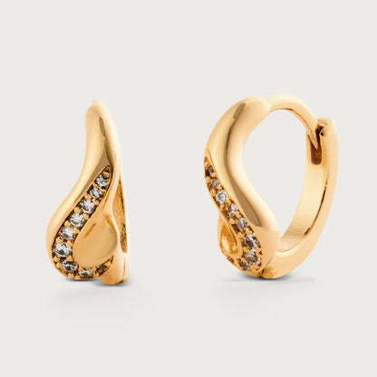 Gold hoop earrings with diamond accents on a light gray background