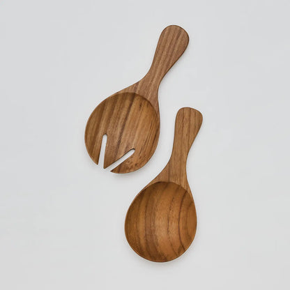 Short salad servers from our teak range, beautifully crafted from teak root. The natural wood grain makes each piece unique in its shape and pattern, meaning no two are exactly alike.
