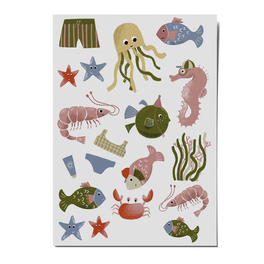 A sheet of colorful underwater-themed stickers featuring sea creatures like a jellyfish, seahorse, crab, shrimp, fish, starfish, and striped shorts on a light gray background.