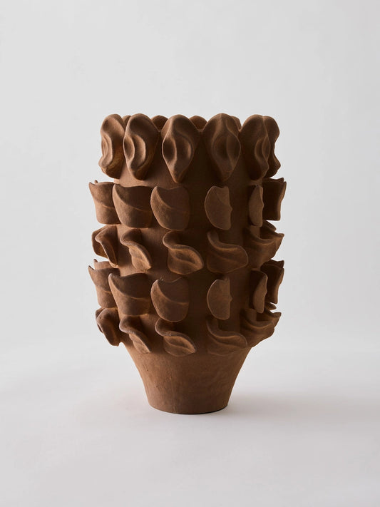 Brown textured vase on a white background