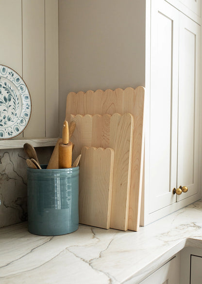Add whimsical charm to your kitchen with this Scalloped Cutting Board. Handcrafted from solid maple wood and finished with a food grade oil, these cutting boards is a beautiful yet functional addition for daily use.