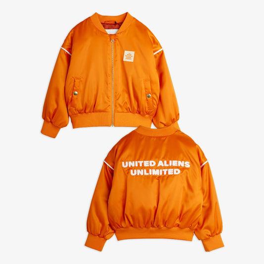 Orange jacket with 'United Aliens Unlimited' text on a white background