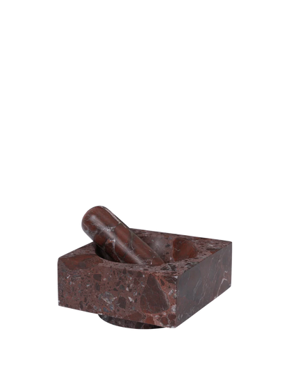 Brown stone mortar and pestle on a white background