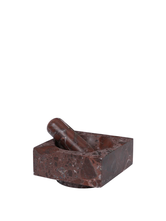 Brown stone mortar and pestle on a white background