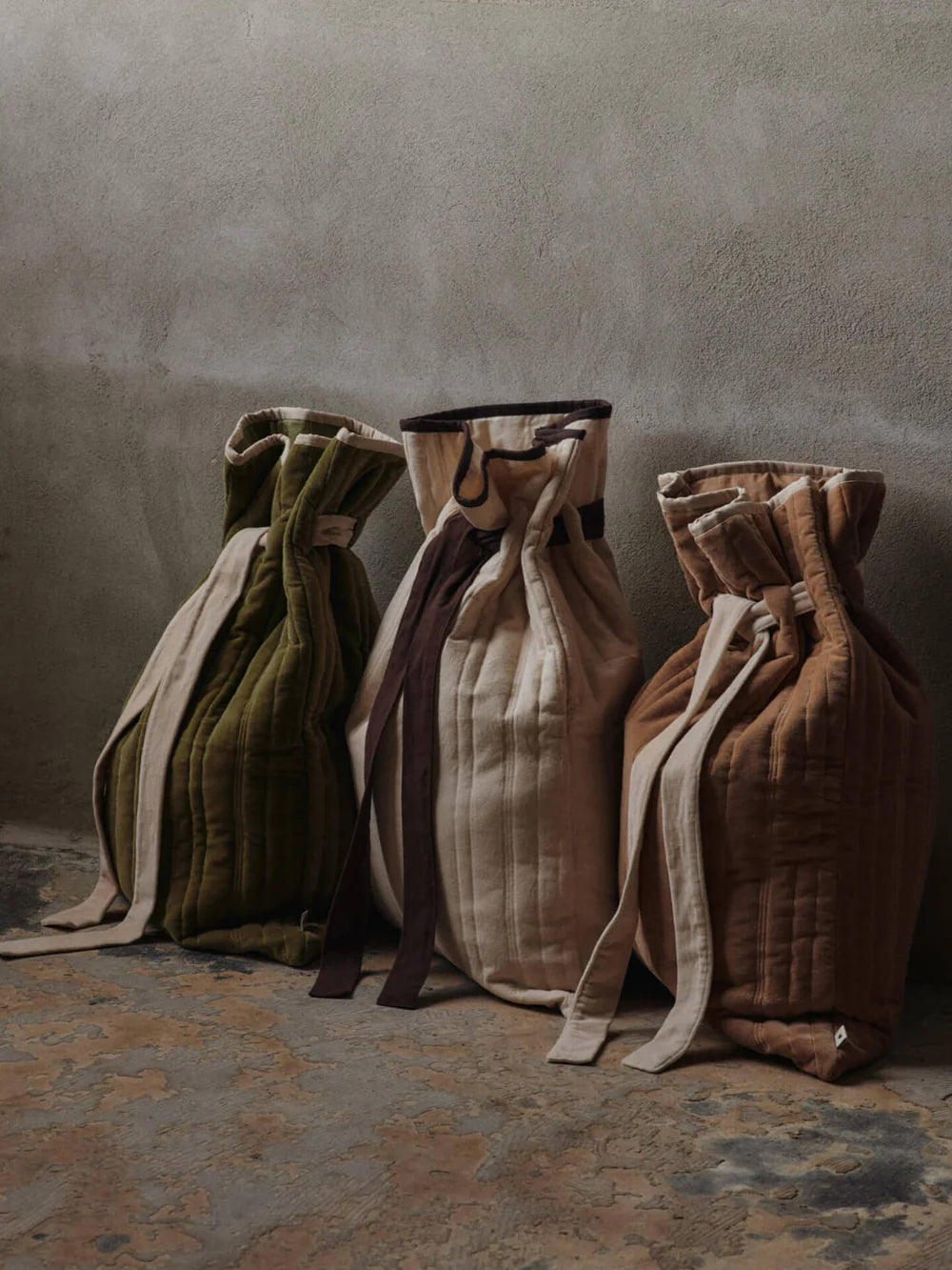 The Vari Quilted Sack is a spacious gift bag with a drawstring pull in soft earthy tones that will elevate your christmas or holiday gift giving or decor. They are found at Huset Shop in Venice Beach a Scandinavian Store. These are Danish holiday decor items