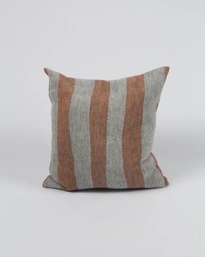 Striped pillow with brown and gray pattern on a white background