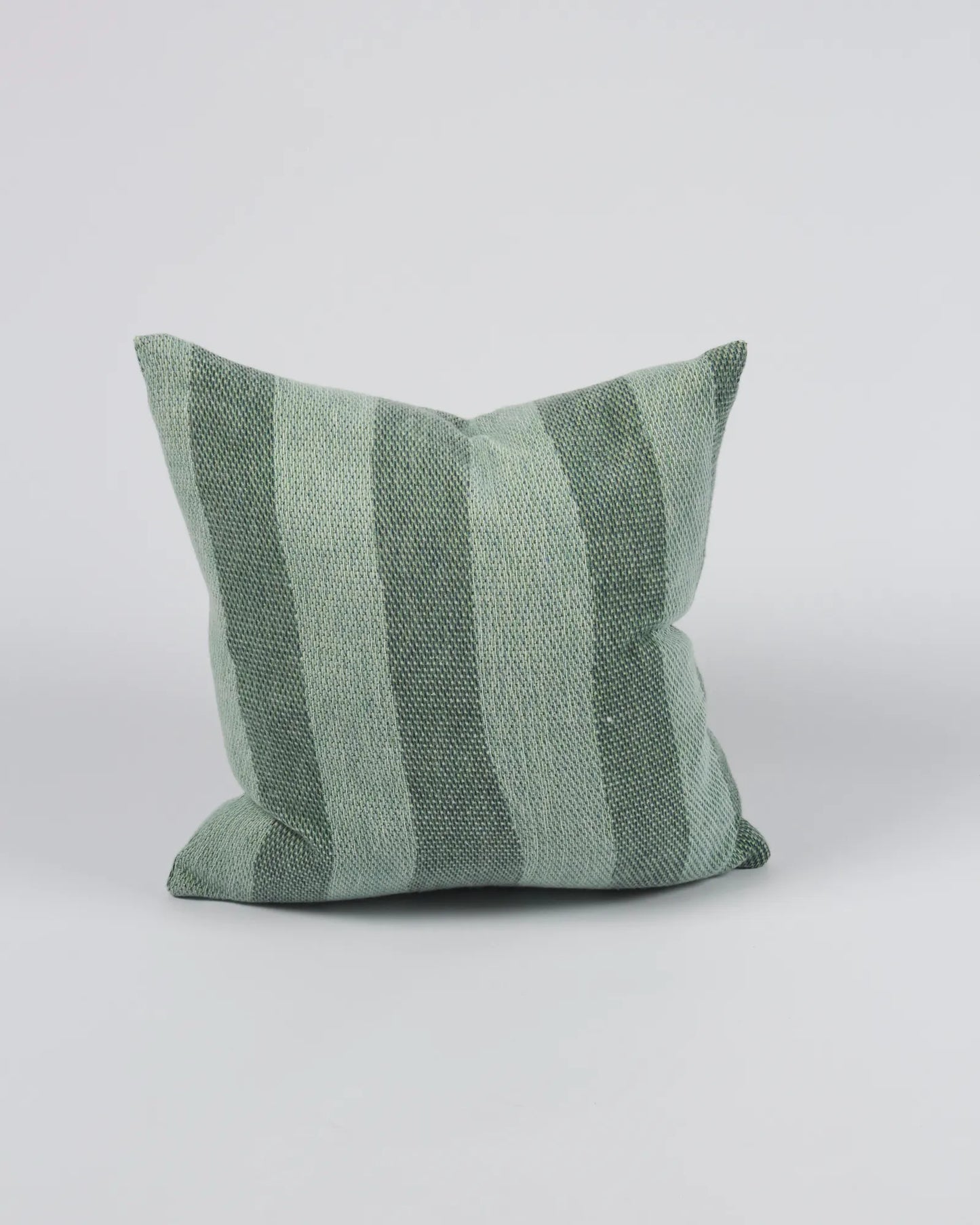 Green striped pillow on a white background