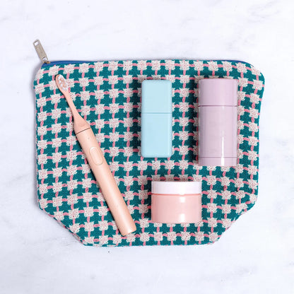 Cosmetic bag with skincare products on a white background