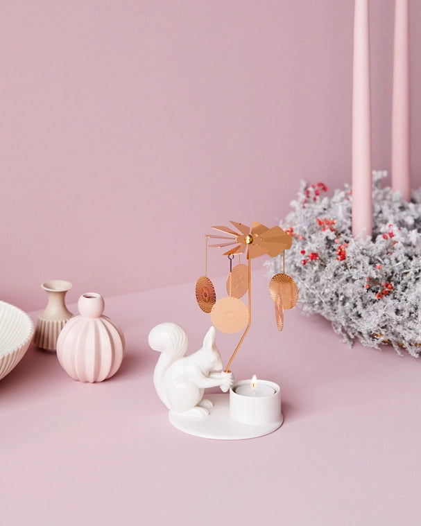 Made in Denmark the Squirrel with its angel chime brings playful light patterns into your living room. It is a cheerful and magical tale which will bring you warm and friendly companionship in the long, cosy days of winter. A decorate item without sound. Use tealights.