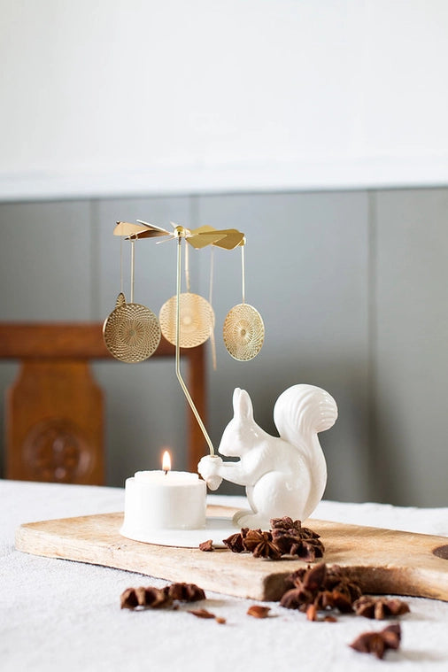 Made in Denmark the Squirrel with its angel chime brings playful light patterns into your living room. It is a cheerful and magical tale which will bring you warm and friendly companionship in the long, cosy days of winter. A decorate item without sound. Use tealights.