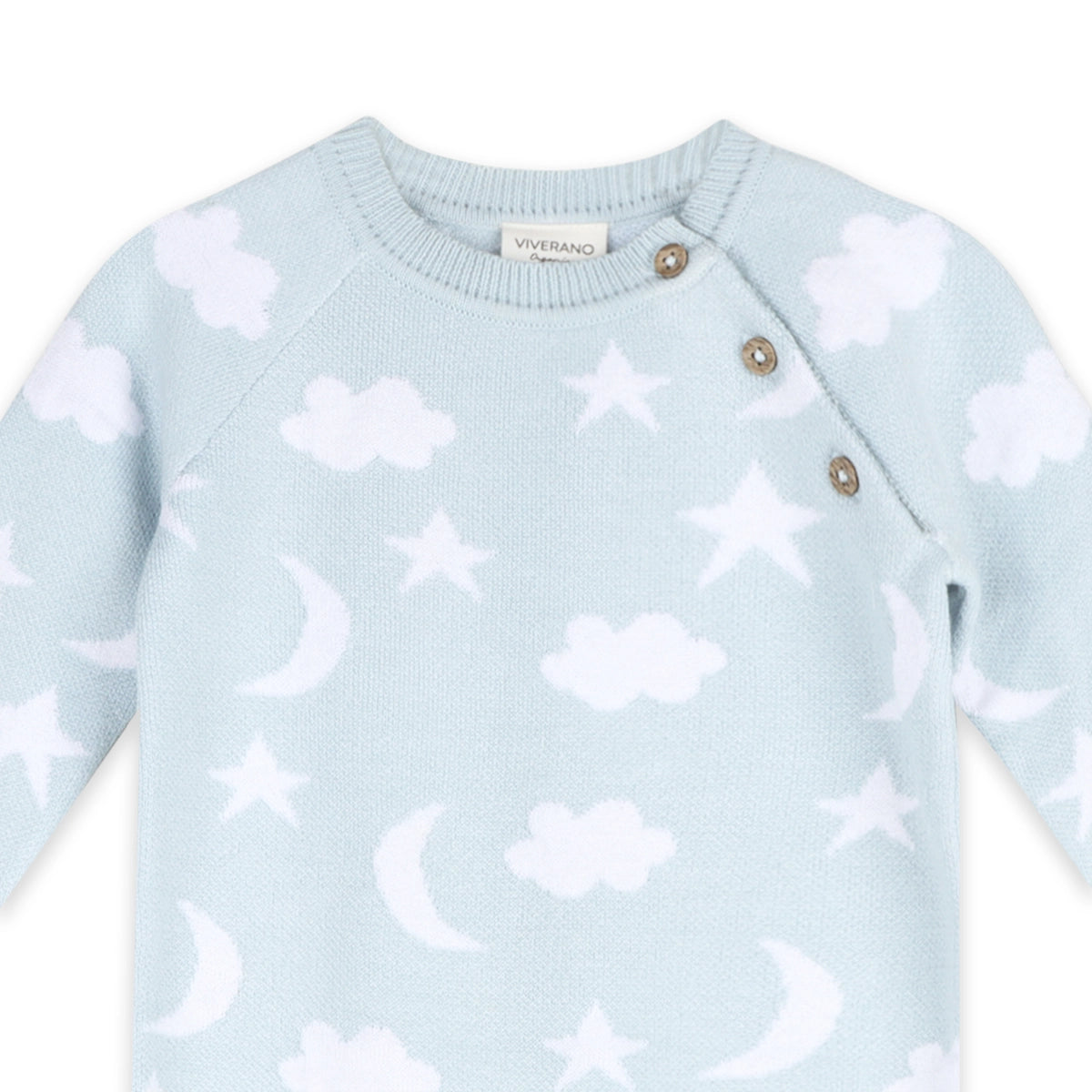 Light blue sweater with cloud and star patterns on a white background