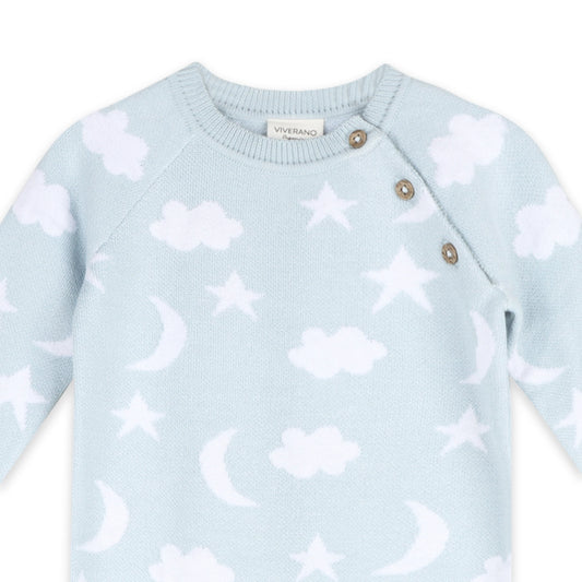 Light blue sweater with cloud and star patterns on a white background