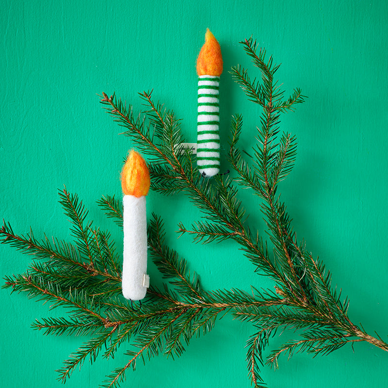 Decorate branches or Christmas trees with wool candlesticks that bring a reto vintage whimsy to your decor. The homemade nature of the decor is cute.