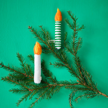 Decorate branches or Christmas trees with wool candlesticks that bring a reto vintage whimsy to your decor. The homemade nature of the decor is cute.