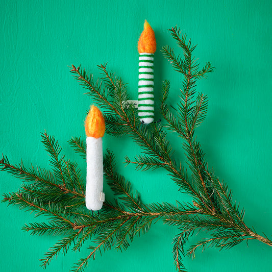 Decorate branches or Christmas trees with wool candlesticks that bring a reto vintage whimsy to your decor. The homemade nature of the decor is cute.