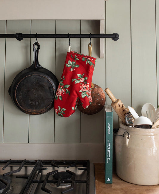 Add a pop of color to your kitchen with our classic oven mitt set. Each mitt is sewn by Amish seamstresses and thoughtfully crafted to provide functional protection. Included on each mitt is a convenient hanging loop for easy storage. 12 inches long